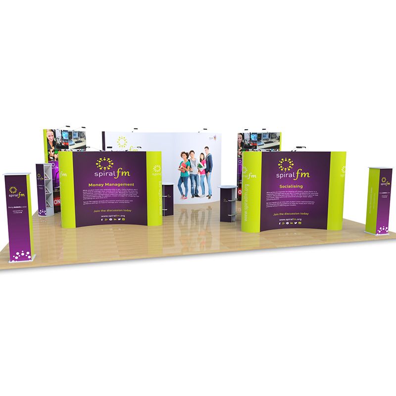 8m x 10m Jumbo S Shape backdrop, with double sided Jumbo Pop Ups, Pop Up Islands, Promo towers, Brandon leaflet dispenser, Rockport counters and Pop Up lights